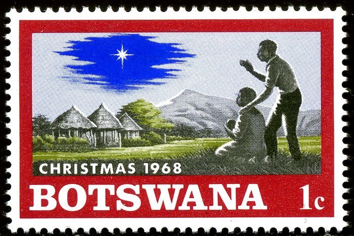 Native family with child, Christmas star on African Landscap