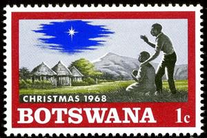 Stamp, Native family with child, Christmas star on African Landscap, Botswana,  