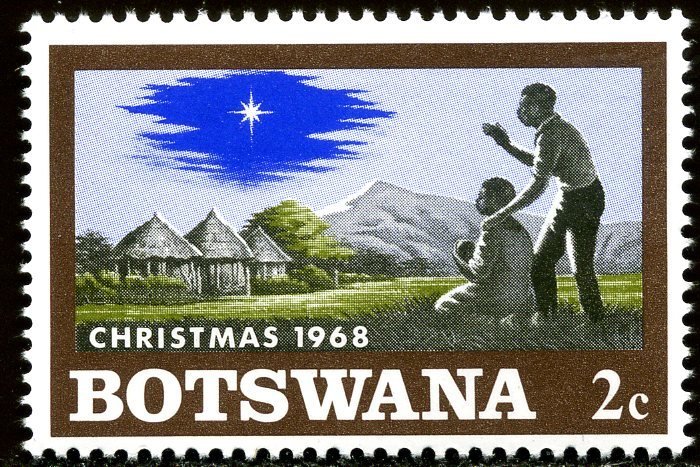 Native family with child, Christmas star on African Landscap