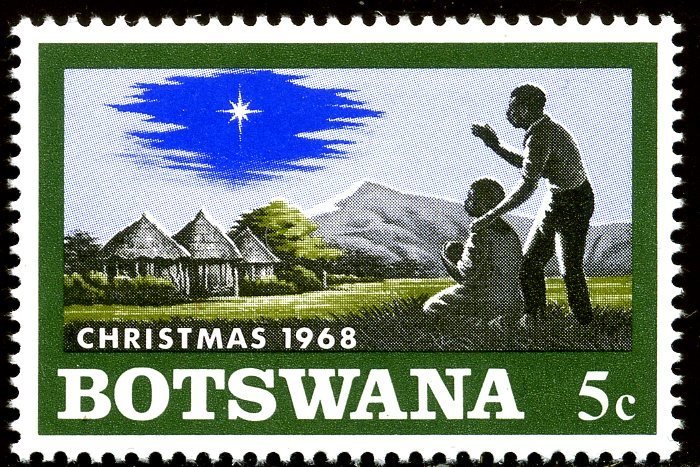 Native family with child, Christmas star on African Landscap