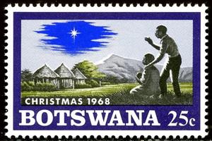 Stamp, Native family with child, Christmas star on African Landscap, Botswana,  