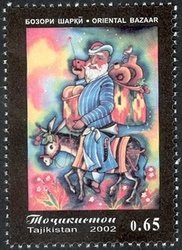 Old man on a donkey with full bags