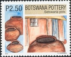 Finished Setswana pots kept under shade of a house