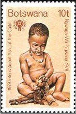 Child playing with rag doll