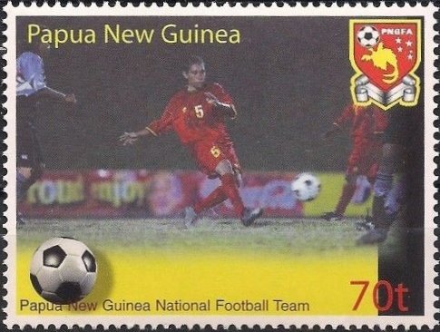Red jerseyed Soccer players in action
