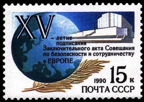 Земной шар с контурной картой Европы на переднем плане. Пальмовая ветвь мира