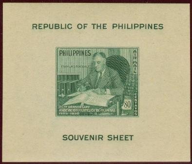 Franklin D. Roosevelt with stamp collection