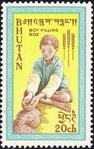 Stamp, Boy filling grain box, Bhutan,  
