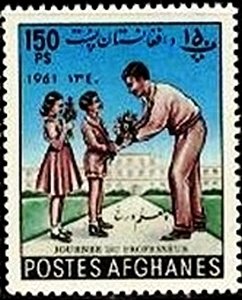 Children giving flowers to teacher