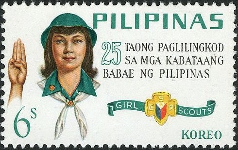 Girl Scout giving Scout Sign