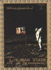 Astronaut in front of flag on the moon