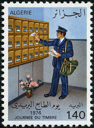 Postman before House letterbox
