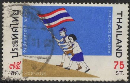 Children carrying flag of Thailand