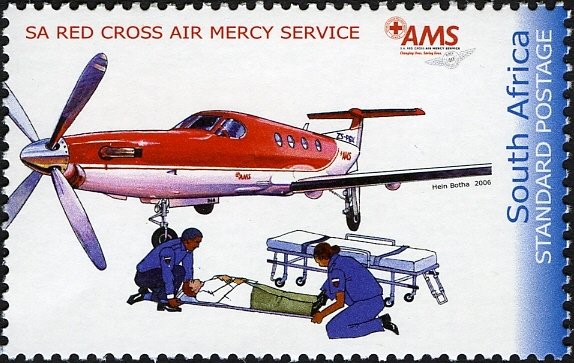 Airplane, paramedics tending to man on stretcher