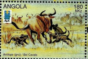 Stamp, Wildebeest (Connochates sp.) and African Hunting Dogs (Lycao, Angola,  , Animals (Fauna)