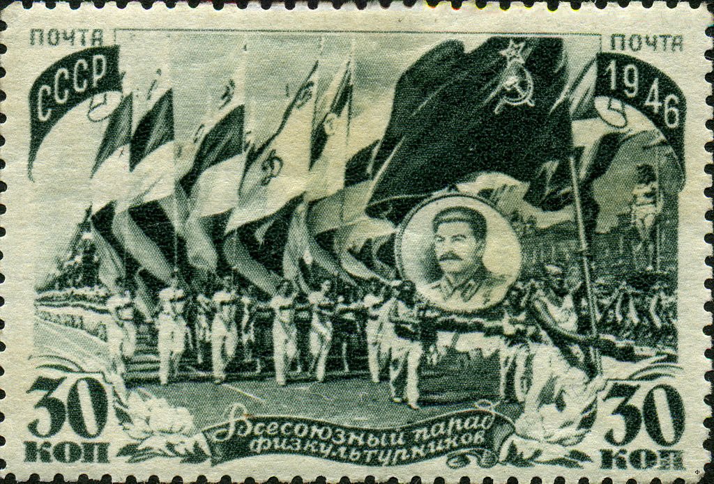 Athletes carrying flags and portrait of Joseph Stalin