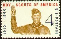 Boy Scout giving scout sign, 50th anniversary of Boy Scouts