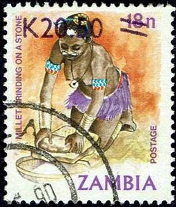 Stamp, Millet grinding on a stone, Zambia,  