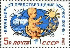 Hand holding baby on the background of globe