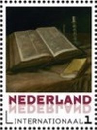 Open bible and candleholder
