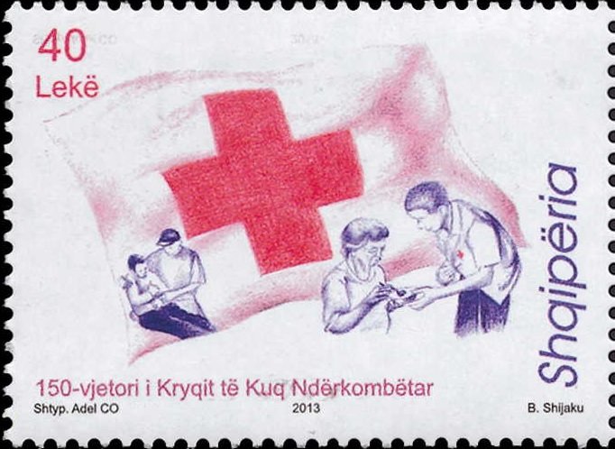 Red cross and aid workers helping injured man, feeding woman