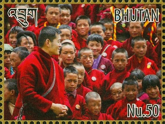 King Jigme Khesar Namgyel Wangchuck and crowd of children