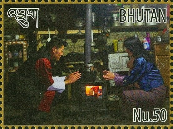 King Jigme and Queen Jetsun near stove