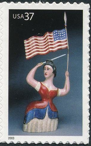Carving of Woman with Flag & Sword
