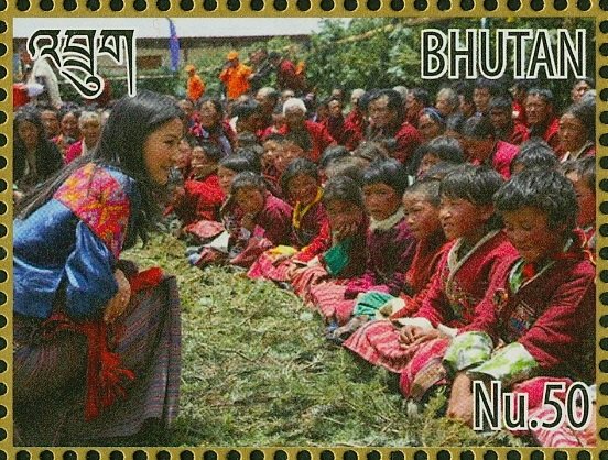 Queen Jetsun Pema and crowd of children