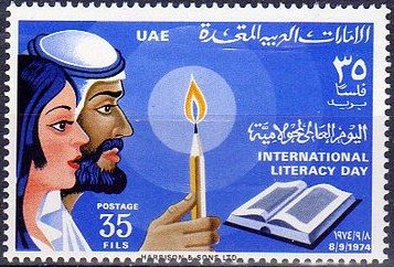 Arab Man and Woman Holding Candle over Book