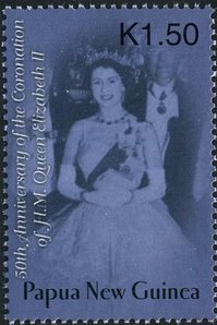 Queen wearing white evening dress, sash and tiara
