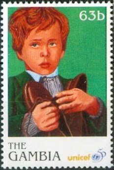 Boy holding shoes