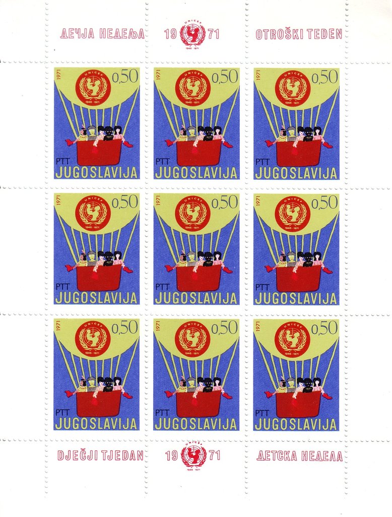 Children of different races in air balloon & UNICEF emblem