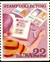 Boy Examining Stamp Collection