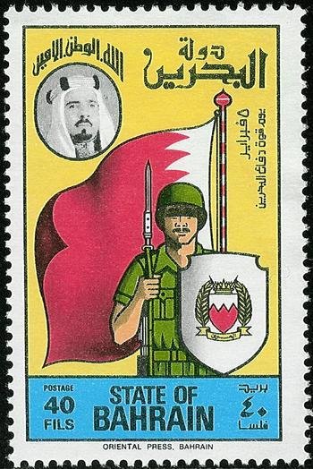Soldier in front of flag, coat of arms of Bahrain