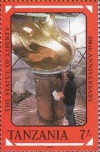 Worker gilding torch