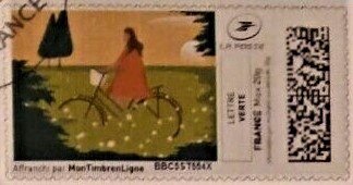 Girl on a Bike in a Green Field