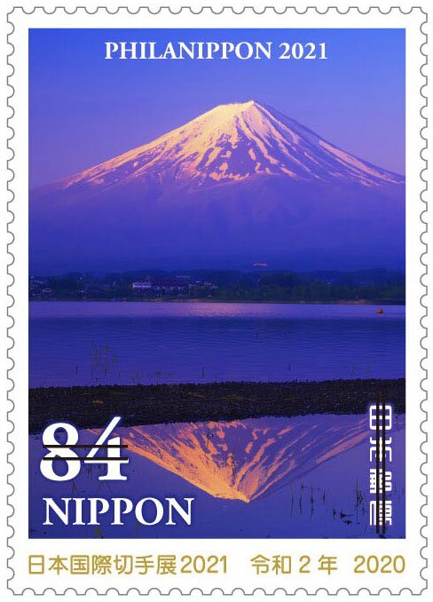Mount Fuji and its reflection in Lake Kawaguchi at dawn